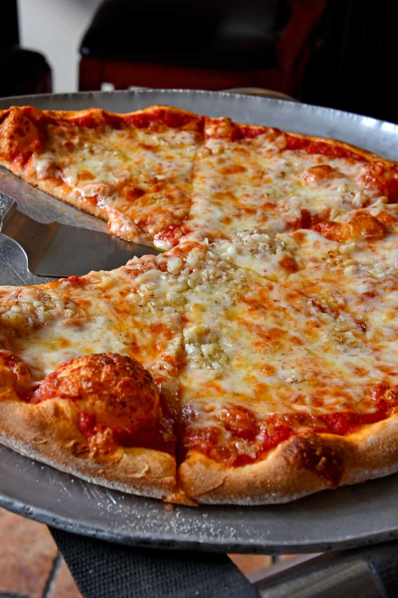 Where did the Brooklyn Style of Pizza originate from