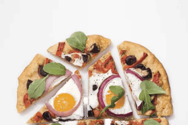 Pizza-with-Eggs-Roasted-Red-Peppers-Olives-and-Arugula