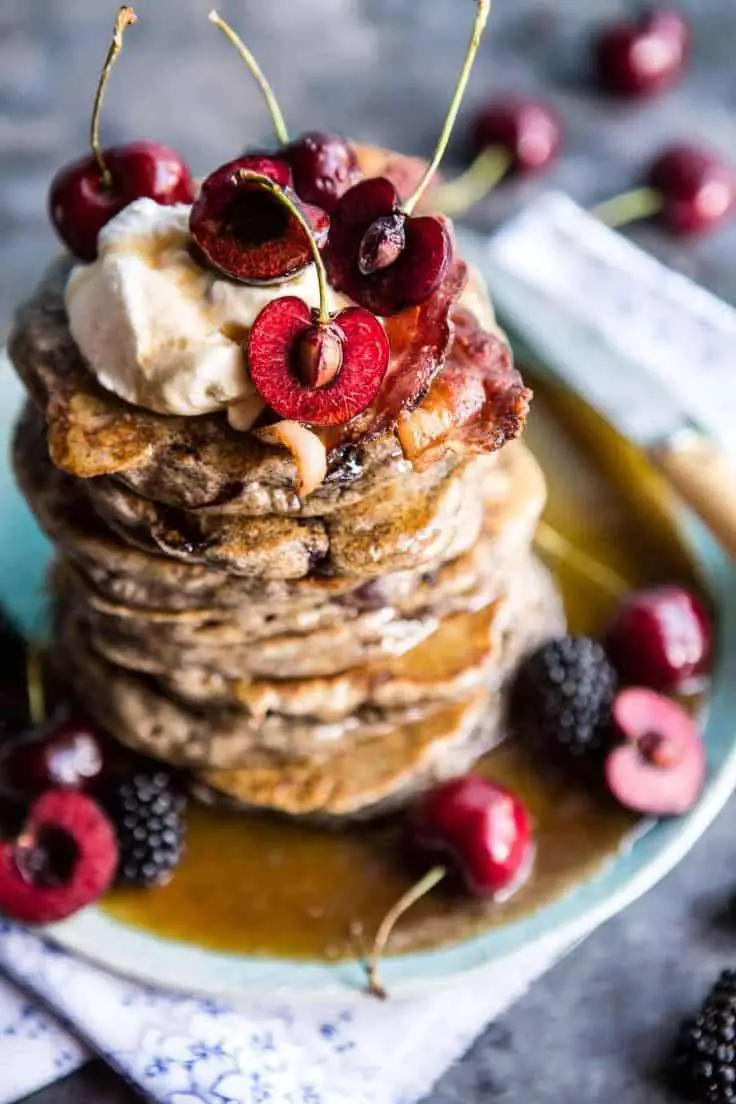 Buckwheat Pancakes With Sweet Cherry. Bourbon Butter Syrup And Bacon