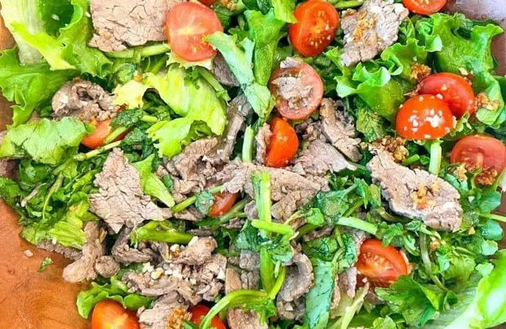 Watercress And Strawberry Salad With Red Onions And Hazelnuts
