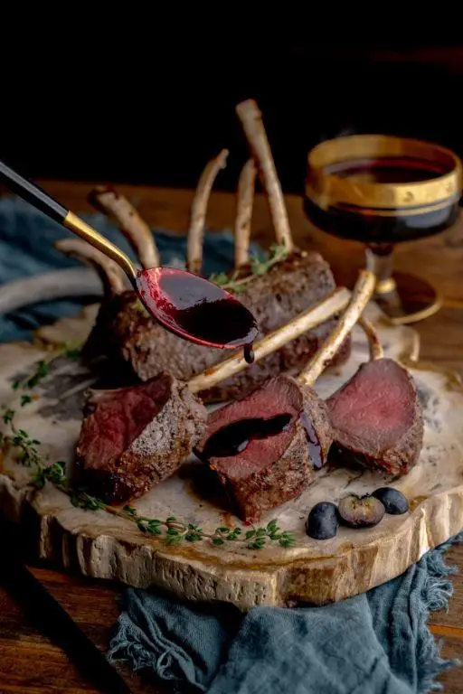 Herb-Crusted Venison Backstrap with Blueberry Sauce